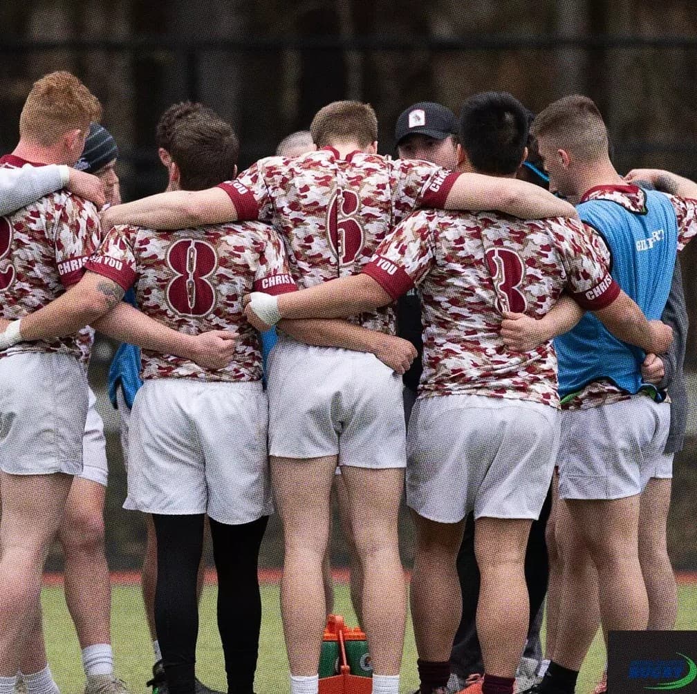 Norwich men’s rugby huddle on the field