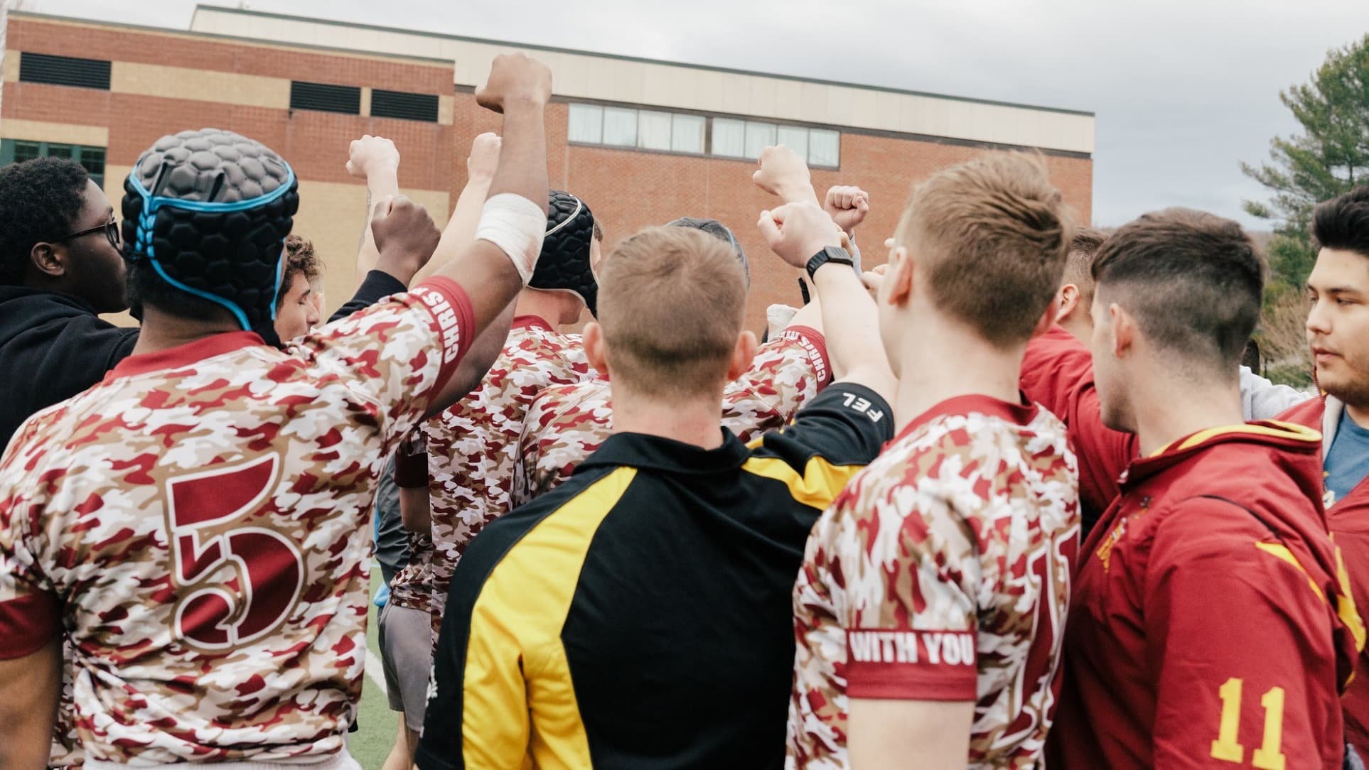 Norwich men’s rugby huddle at the 2026 Chris Munn 7s