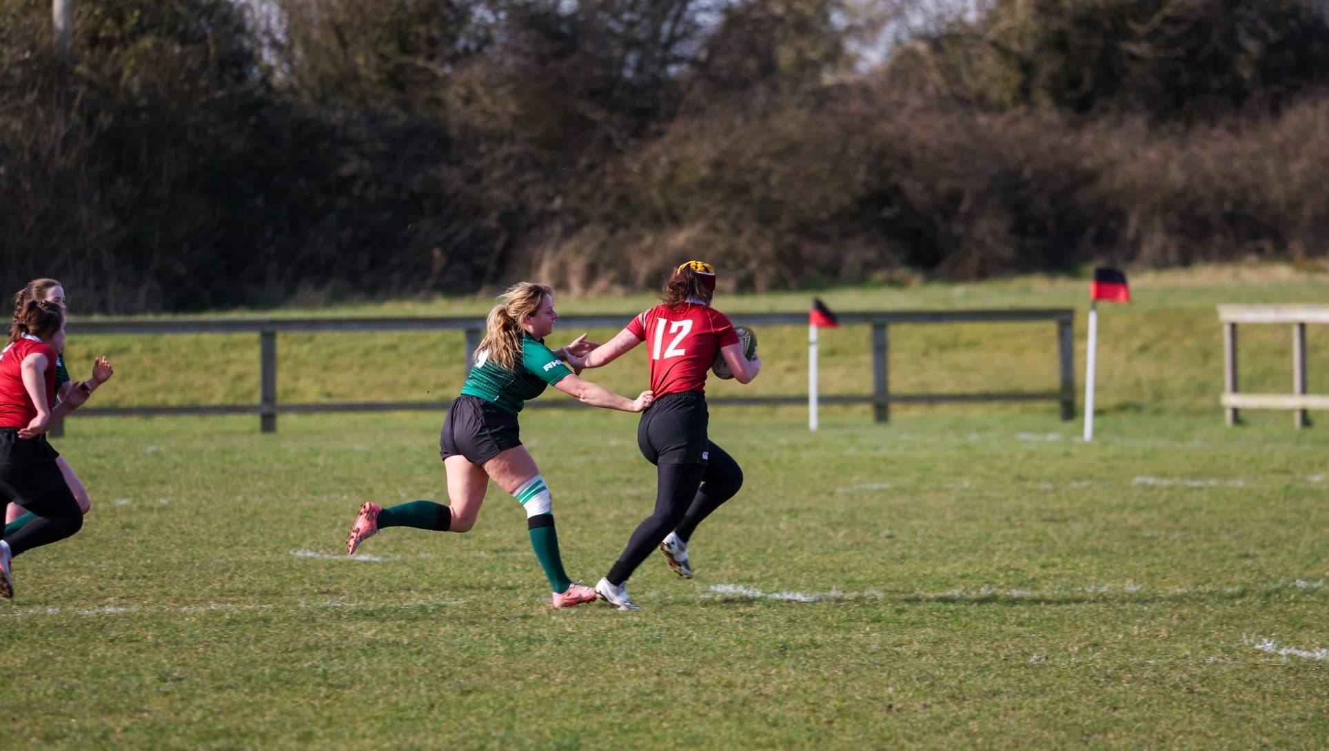 Norwich women’s rugby player number 12 carrying the ball at the 2025 CRC